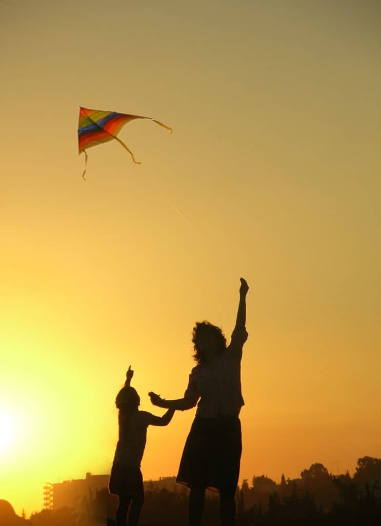 mother son playing kite